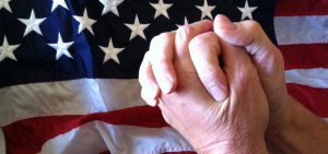 Praying_hands_in_front_of_American_flag